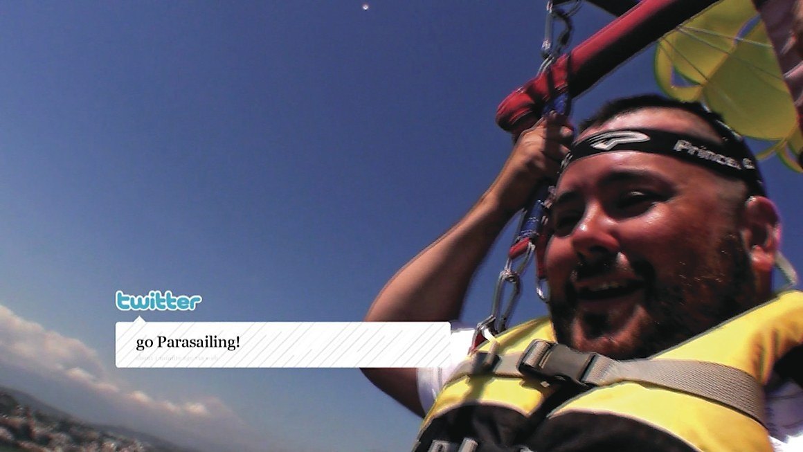 David parasailing over Cannes on the tweet command, go Parasailing